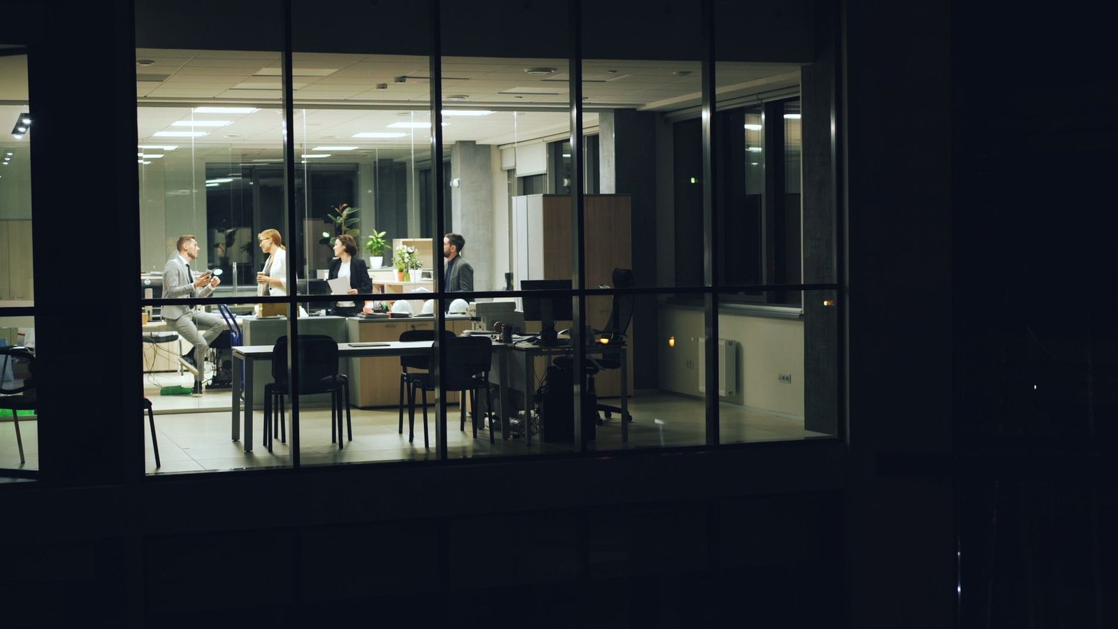 night office meeting viewed from outside
